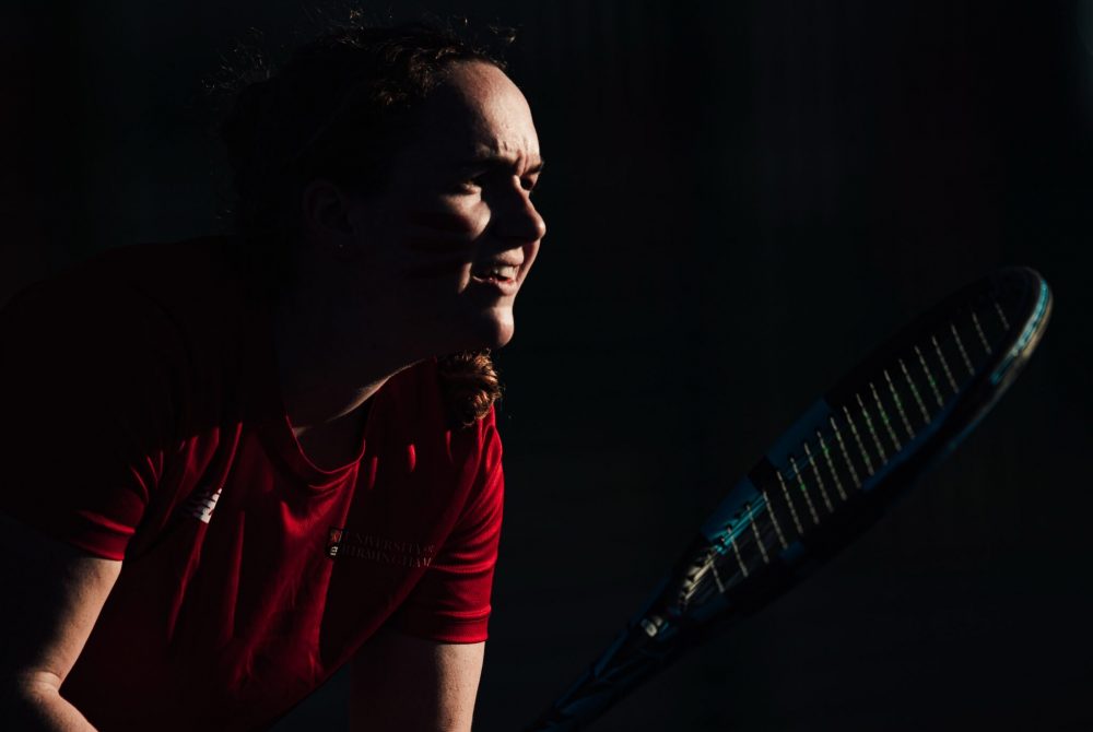 Tennis player preparing to return shot